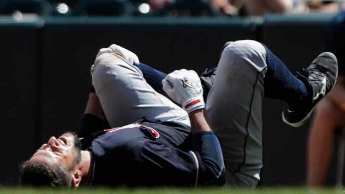 Yan Gomes reacts after being injured on a play at first