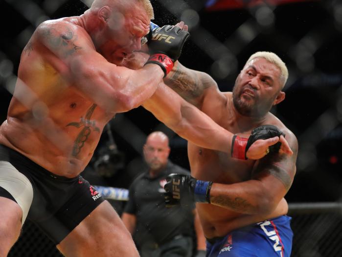 Mark Hunt punches Brock Lesnar during UFC 200